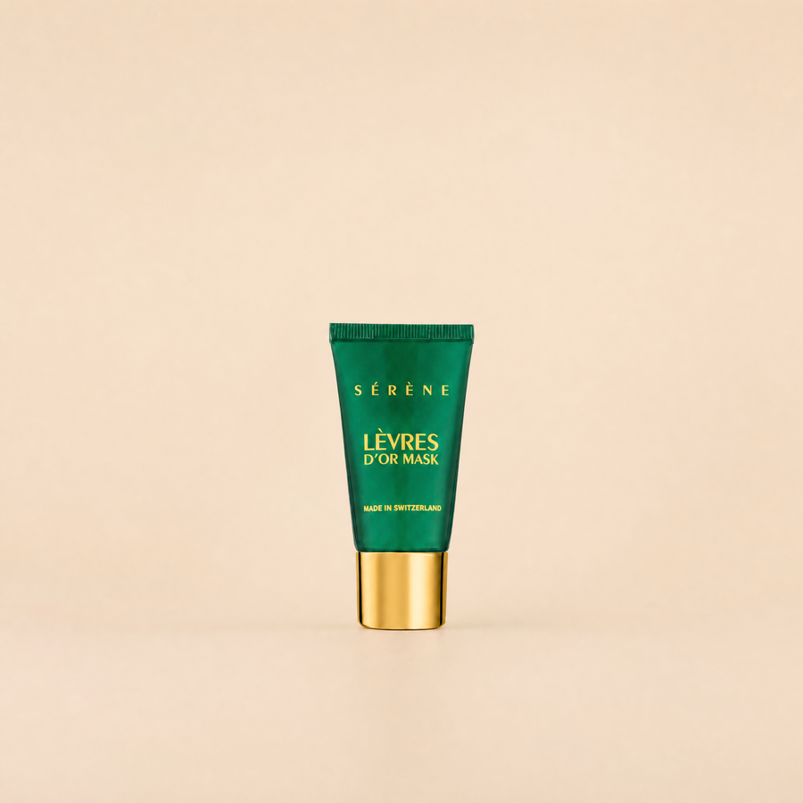 Green skincare mask tube with gold cap on a beige background